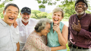 Five older firends laughing and hanging out