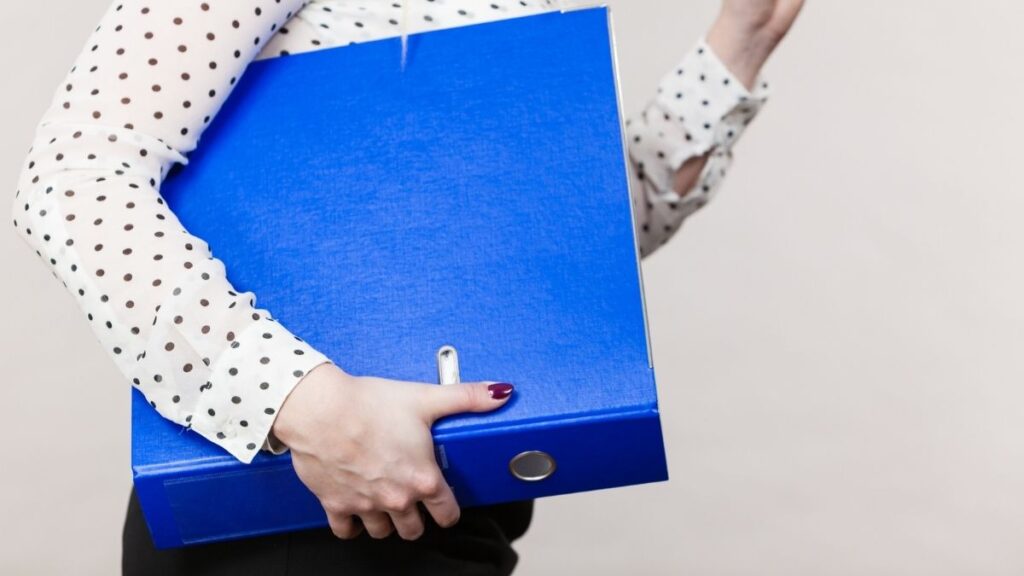 a person holding a binder