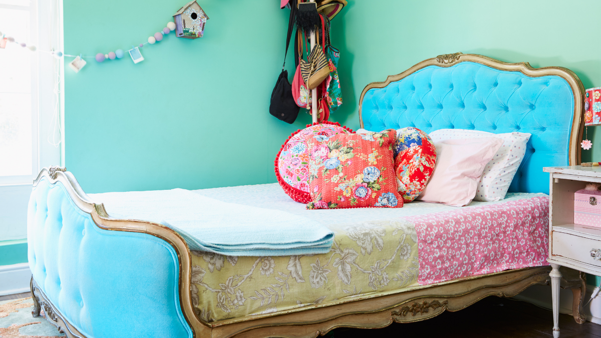 girls bedroom with vintage tufted bed